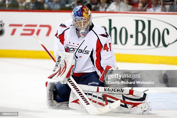 Semyon Varlamov of the Washington Capitals makes a pad save on the puck in Game Four of the Eastern Conference Quarterfinals against the Montreal...