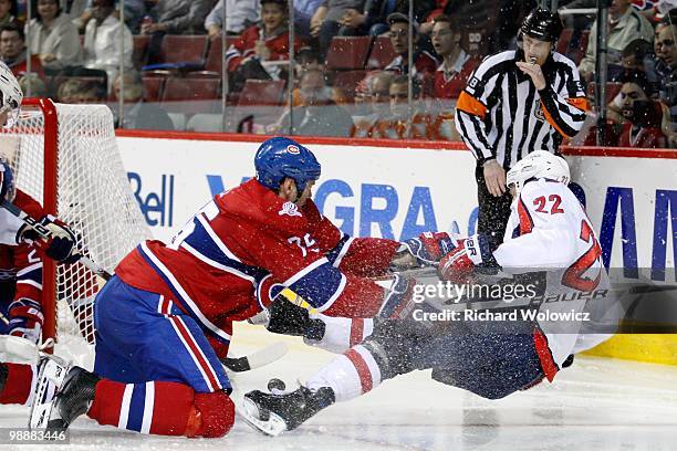 Hal Gill of the Montreal Canadiens clears Mike Knuble of the Washington Capitals from in front of the net in Game Four of the Eastern Conference...