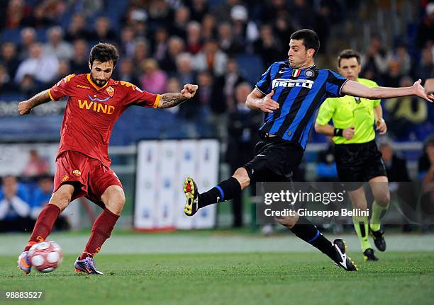 Mirko Vucinic of Roma and Thiago Motta of Inter in action during the match the Tim Cup between FC Internazionale Milano and AS Roma at Stadio...