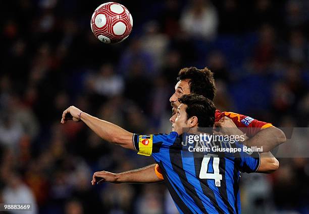 Mirko Vucinic of Roma and Javier Zanetti of Inter in action during the match the Tim Cup between FC Internazionale Milano and AS Roma at Stadio...