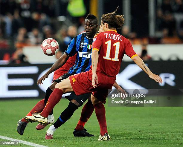 Mario Balotelli of Inter and Rodrigo Taddei of Roma in action during the match the Tim Cup between FC Internazionale Milano and AS Roma at Stadio...