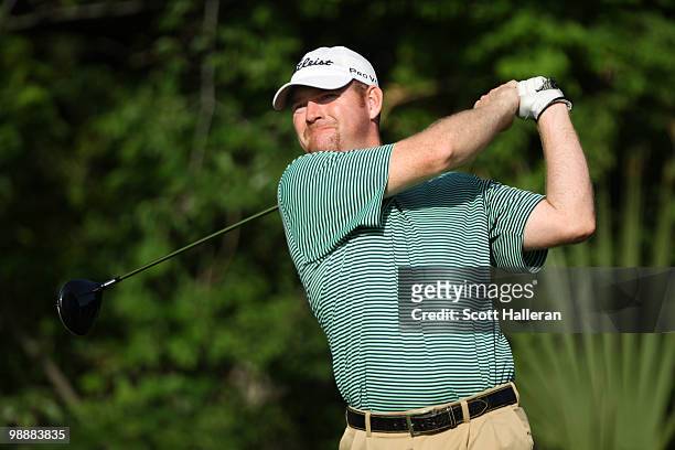 Troy Matteson watches his tee shot on the fifth hole during the first round of THE PLAYERS Championship held at THE PLAYERS Stadium course at TPC...