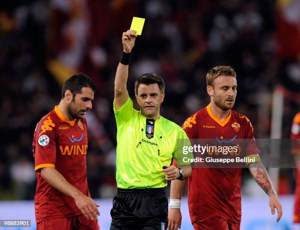 The referee Nicola Rizzoli shows the yellow card to Simone Perrotta of Roma during the match the Tim Cup between FC Internazionale Milano and AS Roma...