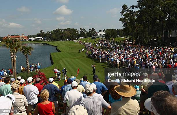 Phil Mickelson hits his tee shot on the 18th hole during the first round of THE PLAYERS Championship held at THE PLAYERS Stadium course at TPC...
