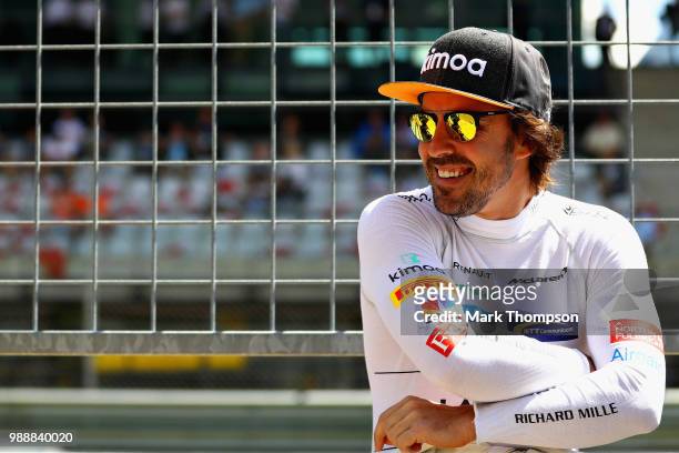 Fernando Alonso of Spain and McLaren F1 looks on in the Pitlane before the Formula One Grand Prix of Austria at Red Bull Ring on July 1, 2018 in...