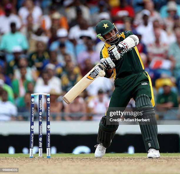 Saeed Ajmal of Pakistan scores runs during The ICC World Twenty20 Super Eight match between Pakistan and England played at The Kensington Oval on May...