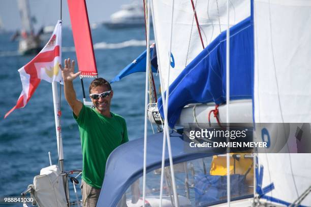 English born-Australian skipper Kevin Farebrother sails his boat "Sagarmatha" in Les Sables d'Olonne Harbour on July 1 at the start of the solo...