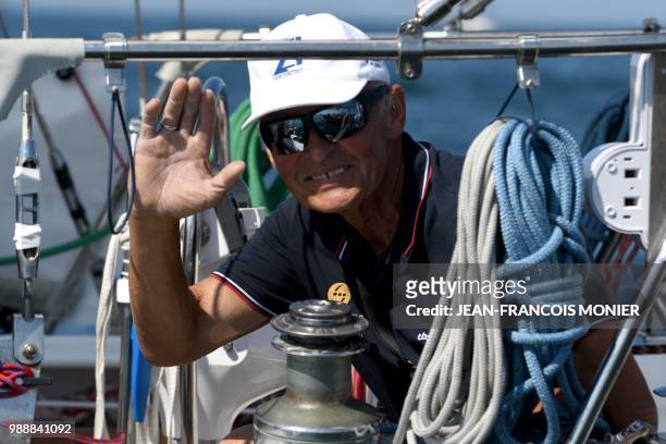 Russia's Igor Zaretskiy on his boat "Esmeralda" sets sail from Les Sables d'Olonne Harbour on July 1 at the start of the solo around-the-world...