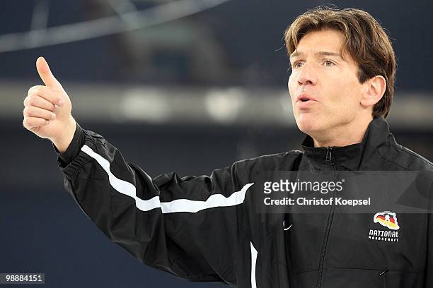 National coach Uwe Krupp of Germany issues instructions during a training session at the Veltins Arena ahead of the IIHF World Championship on May 6,...