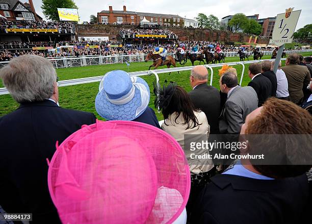 The ladies dig out the hats for ladies day as they watch Dress Up and William Buick win The Abode Hotel EBF Maiden Stakes at Chester racecourse on...