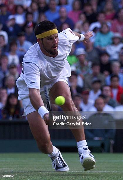 Patrick Rafter of Australia in action against Hicham Arazi of Morroco during the men's third round of The All England Lawn Tennis Championship at...