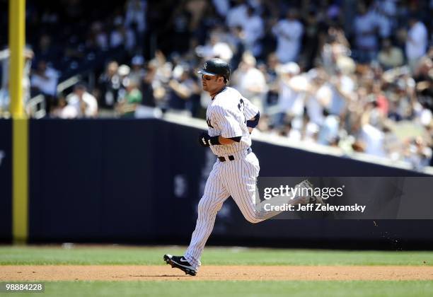 Nick Swisher of the New York Yankees hits a home run against the Baltimore Orioles at Yankee Stadium on May 5, 2010 in the Bronx borough of New York...