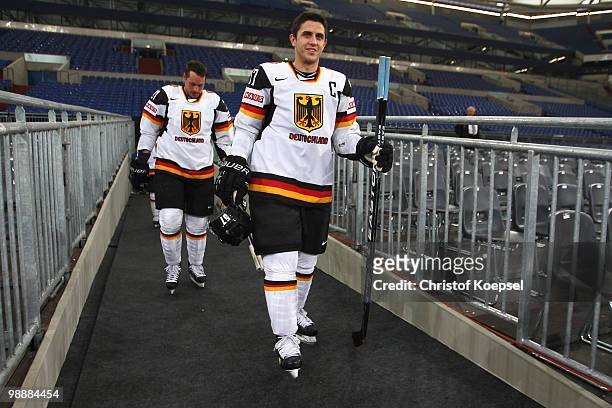 John Tripp and Marcel Goc of Germany walk to during a training session at the Veltins Arena ahead of the IIHF World Championship on May 6, 2010 in...