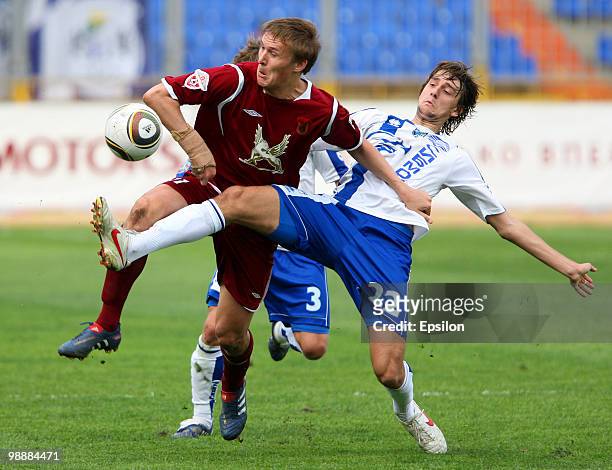 Alexander Bukharov of FC Rubin Kazan battles for the ball with Yegor Filipenko of FC Sibir Novosibirsk during the Russian Football League...