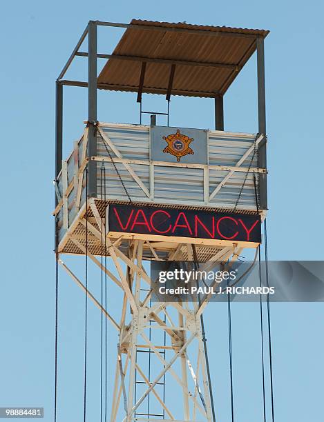 The tallest guard tower overlooking the imate camp displays a neon "vacancy" sign at Sheriff Joe Arpaio's Maricopa County "tent city" jail May 3 in...