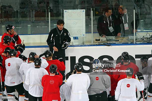 National coach Uwe Krupp of Germany talks to the team during a training session at the Veltins Arena ahead of the IIHF World Championship on May 6,...