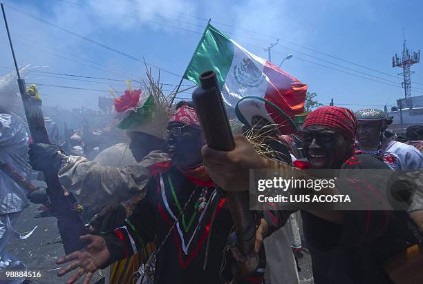 People rally along the streets of the Penon de los Banos neighbourhood in Mexico City, May 5 2010, commemorating Mexico's victory over France in the...