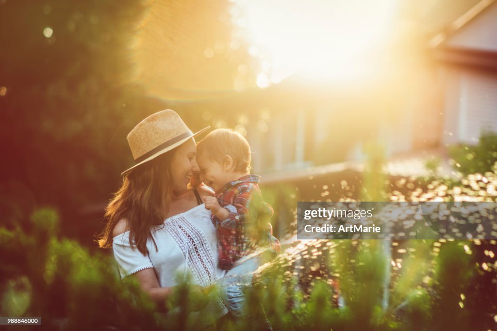 Family in the garden in sunset