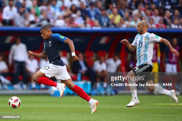 Kylian Mbappe of France and Javier Mascherano of Argentina during the 2018 FIFA World Cup Russia Round of 16 match between France and Argentina at...
