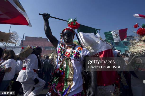 People rally along the streets of the Penon de los Banos neighbourhood in Mexico City, May 5 2010, commemorating Mexico's victory over France in the...