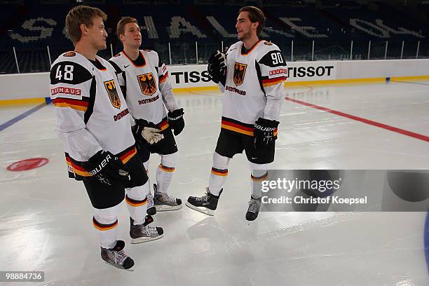 Frank Hoerdler, André Rankel and Constantin Braun of Germany attend a training session at the Veltins Arena ahead of the IIHF World Championship on...