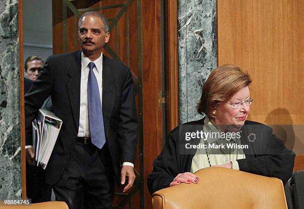 Attorney General Eric Holder enters near by Sen. Barbara Mikulski before the start of a Senate Appropriations Committee hearing on Capitol Hill on...