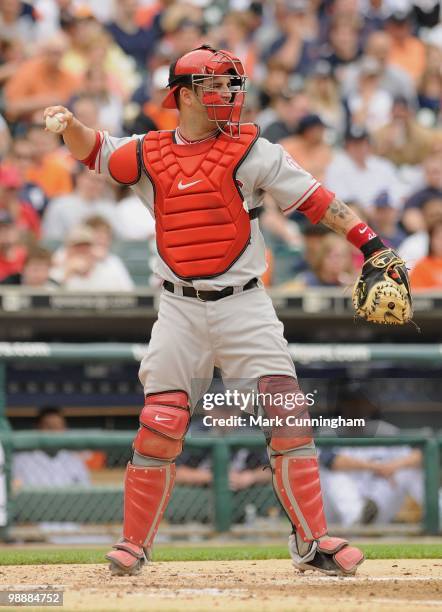 Mike Napoli of the Los Angeles Angels of Anaheim throws the baseball back to the pitcher against the Detroit Tigers during the game at Comerica Park...