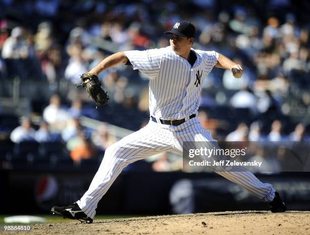 Boone Logan of the New York Yankees delivers against the Baltimore Orioles at Yankee Stadium on May 5, 2010 in the Bronx borough of New York City