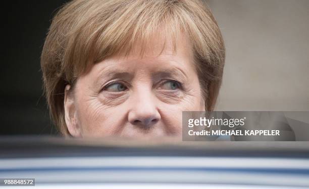 German Chancellor Angela Merkel leaves the German public television ZDF after recording the traditional "summer interview" on July 1, 2018 in Berlin,...