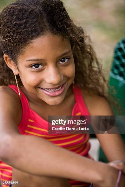 african american girl with braces - derek latta stock-fotos und bilder