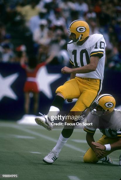 Kicker Jan Stenerud of the Green Bay Packers attempts a field-goal with punter Ray Stachowicz holding for him against the New England Patriots during...