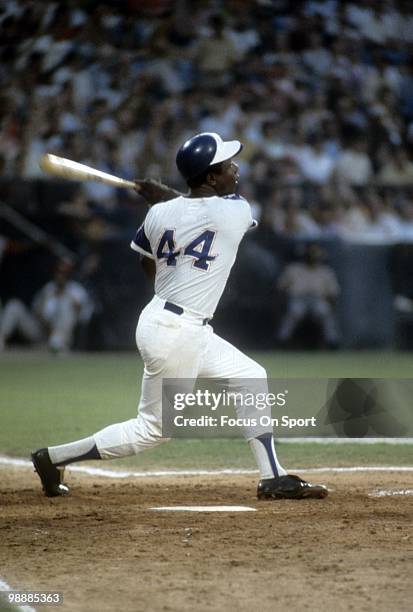 S: Outfielder Hank Aaron of the Atlanta Braves swings and watches the flight of his ball circa early 1970's during a Major League Baseball game at...