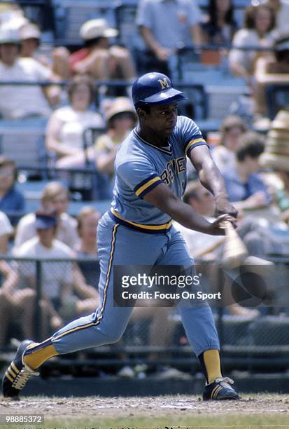 Outfielder Hank Aaron Of the Milwaukee Brewers swings and watches the flight of his ball circa 1975 during a Major League Baseball game. Aaron played...