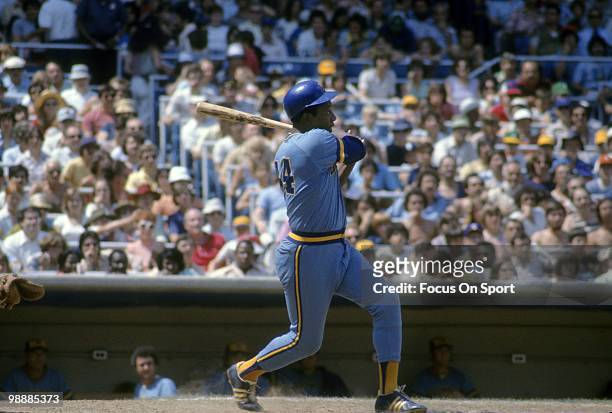 Outfielder Hank Aaron Of the Milwaukee Brewers swings and watches the flight of his ball against the New York Yankees circa 1975 during a Major...