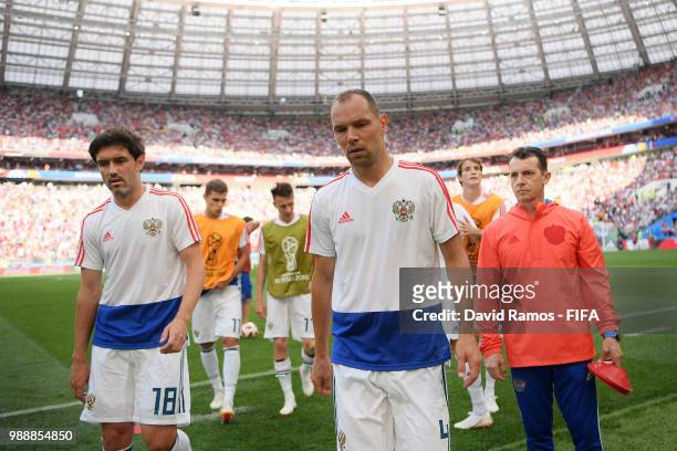 Yury Zhirkov and Sergey Ignashevich of Russia walk off the pitch after warm up prior to the 2018 FIFA World Cup Russia Round of 16 match between...