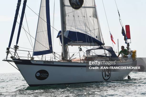 English born-Australian Kevin Farebrother on his boat "Sagarmatha"competes from Les Sables d'Olonne Harbour on July 1 at the start of the solo...