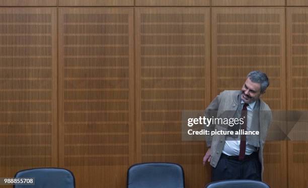 Dpatop - The defendant John Ausonius, known as 'Laserman', enters a court room of the district court in Frankfurt/Main, Germany, 13 December 2017....