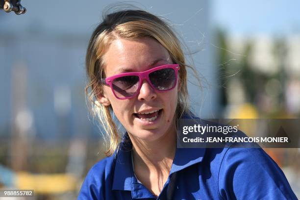 Britain's Susie Goodall looks on from her boat "DHL Starlight" as she sets sail from Les Sables d'Olonne Harbour on July 1 at the start of the solo...