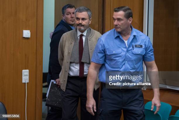 The defendant John Ausonius , known as 'Laserman', enters a court room of the district court in Frankfurt/Main, Germany, 13 December 2017. The...