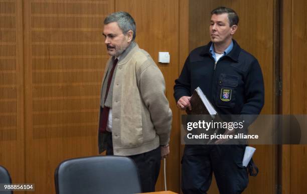 The defendant John Ausonius , known as 'Laserman', enters a court room of the district court in Frankfurt/Main, Germany, 13 December 2017. The...