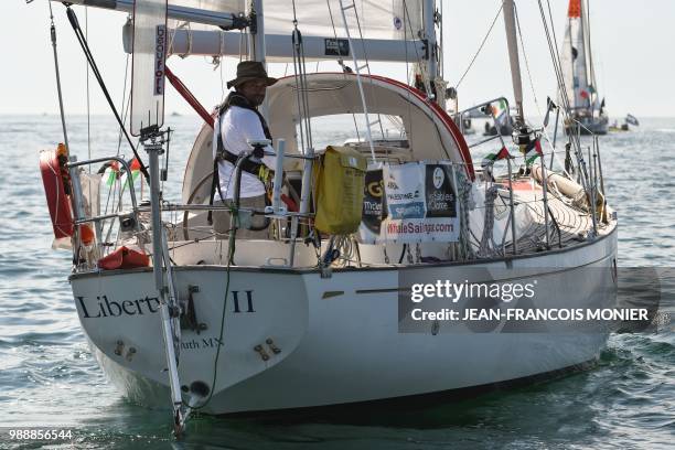 Palestine born, American Nabil Amra, on his boat "Liberty II" sets sail from Les Sables d'Olonne Harbour on July 1 at the start of the solo...