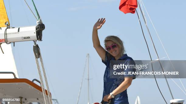 Britain's Susie Goodall looks on from her boat "DHL Starlight" as she sets sail from Les Sables d'Olonne Harbour on July 1 at the start of the solo...