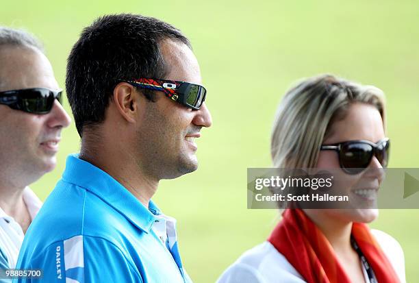 Driver Juan Pablo Montoya and Maria Ochoa watch the play of Camilo Villegas during the first round of THE PLAYERS Championship held at THE PLAYERS...