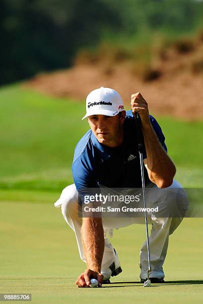 Dustin Johnson lines up his putt during the first round of THE PLAYERS Championship held at THE PLAYERS Stadium course at TPC Sawgrass on May 6, 2010...