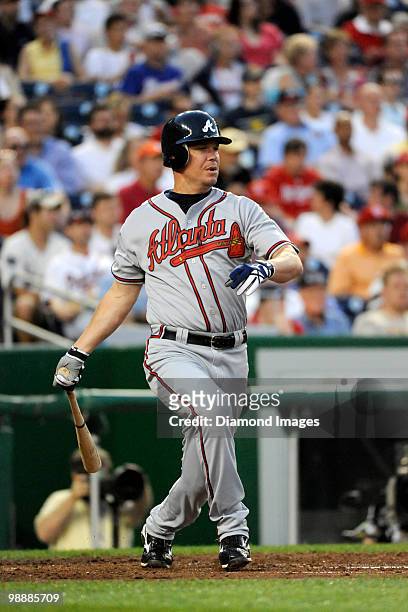 Thirdbaseman Chipper Jones of the Atlanta Braves hits a single to rightfield that scored Martin Prado during the top of the third inning of a game on...