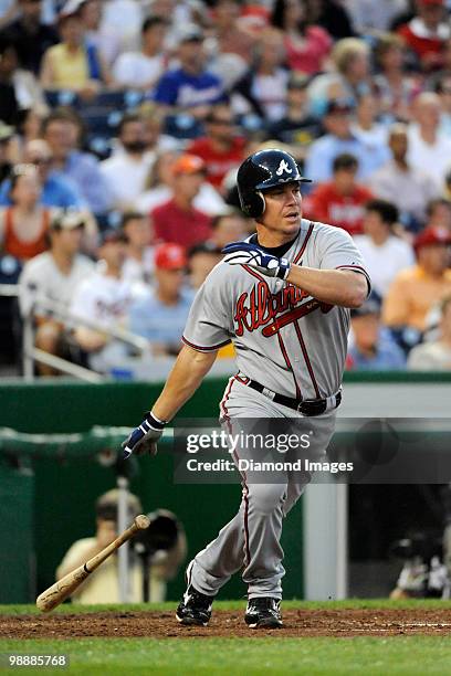 Thirdbaseman Chipper Jones of the Atlanta Braves hits a single to rightfield that scored Martin Prado during the top of the third inning of a game on...