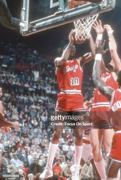 David Greenwood of the Chicago Bulls grabs a rebound against the Washington Bullets during an NBA basketball game circa 1985 at the Capital Centre in...