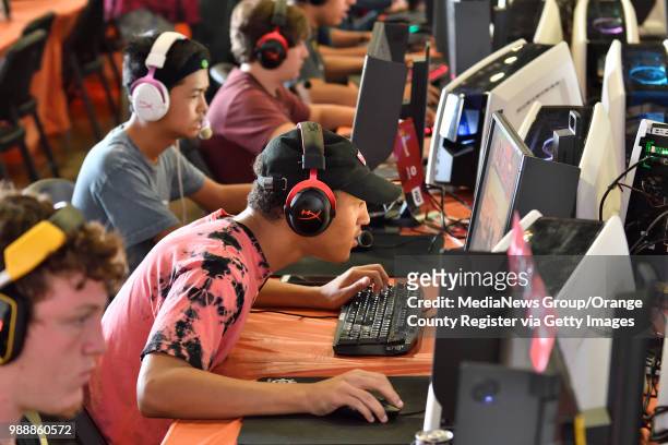 Myles Campbell joins other gamers as they compete in the iBUYPOWER Tournament in The Hanger during the last day of the OC Fair in Costa Mesa,...