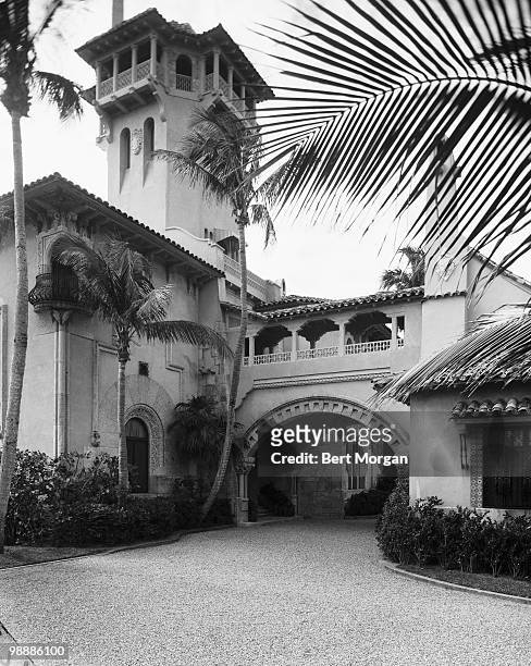 Exterior view along a driveway at the front of the porte-cochere at Mar-a-Lago , Palm Beach, Florida, mid 1950s. The residence, designed by Marion...