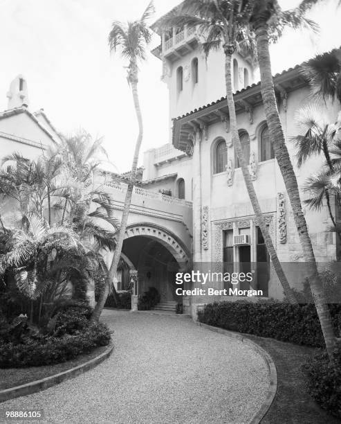 Exterior view along a driveway at the rear of the porte-cochere at Mar-a-Lago , Palm Beach, Florida, mid 1950s. The residence, designed by Marion...